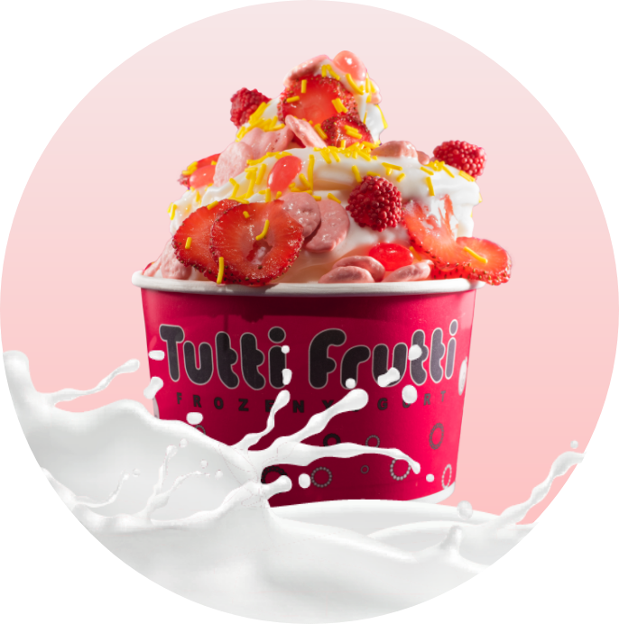 Yogurt helado Tutti Frutti con fresas, frambuesas y chispas.